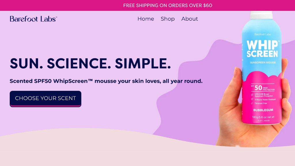 Pink and purple coloured homepage featuring hand holding a can of WhipScreen sunscreen mousse